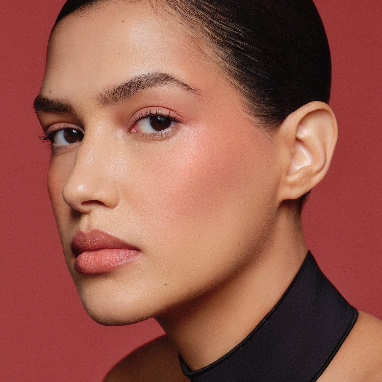 NARS Multiple in Sinful buildable brick red shade.