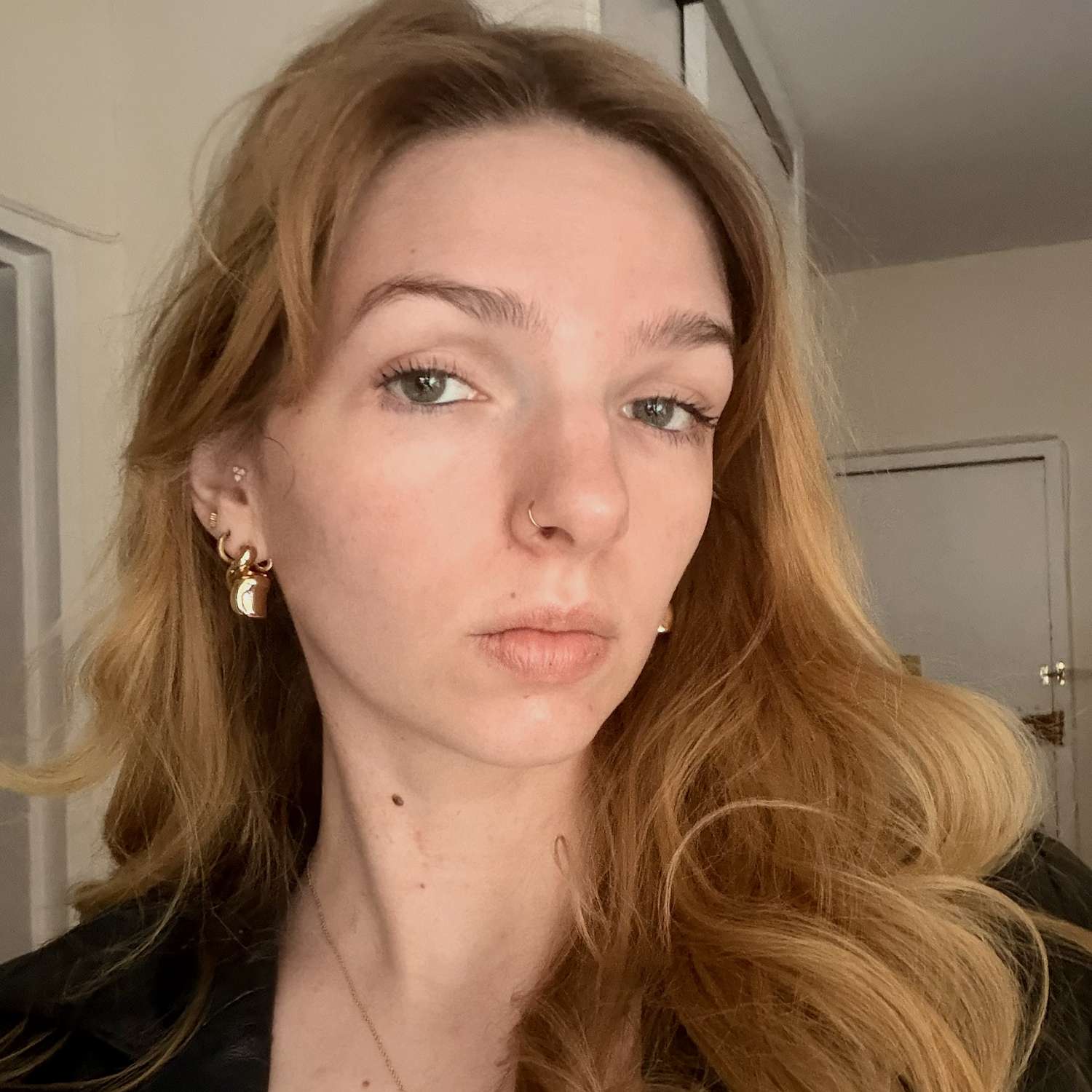 Editor Ali Webb smiling and showing off her fresh, radiant skin after using the mask.