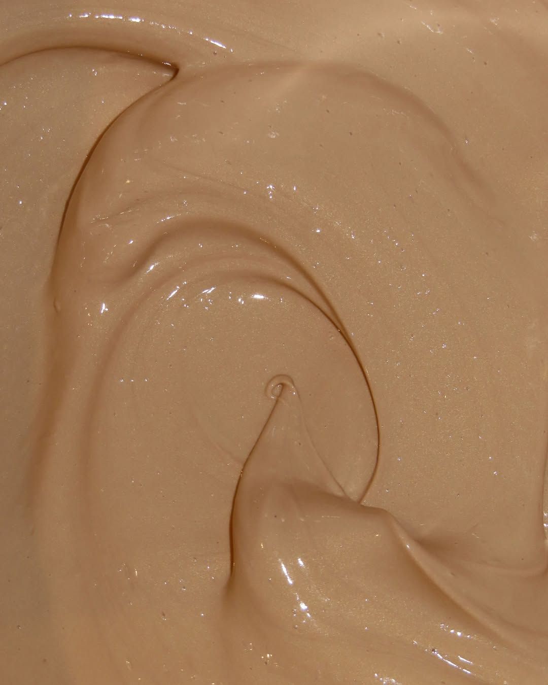 Close-up detail of the glimmery, reflective texture of the Sequin Supreme sunscreen.