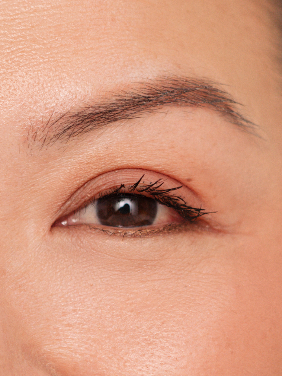 MECCA HQ staff member Hilary testing a dual-ended eyebrow tool.