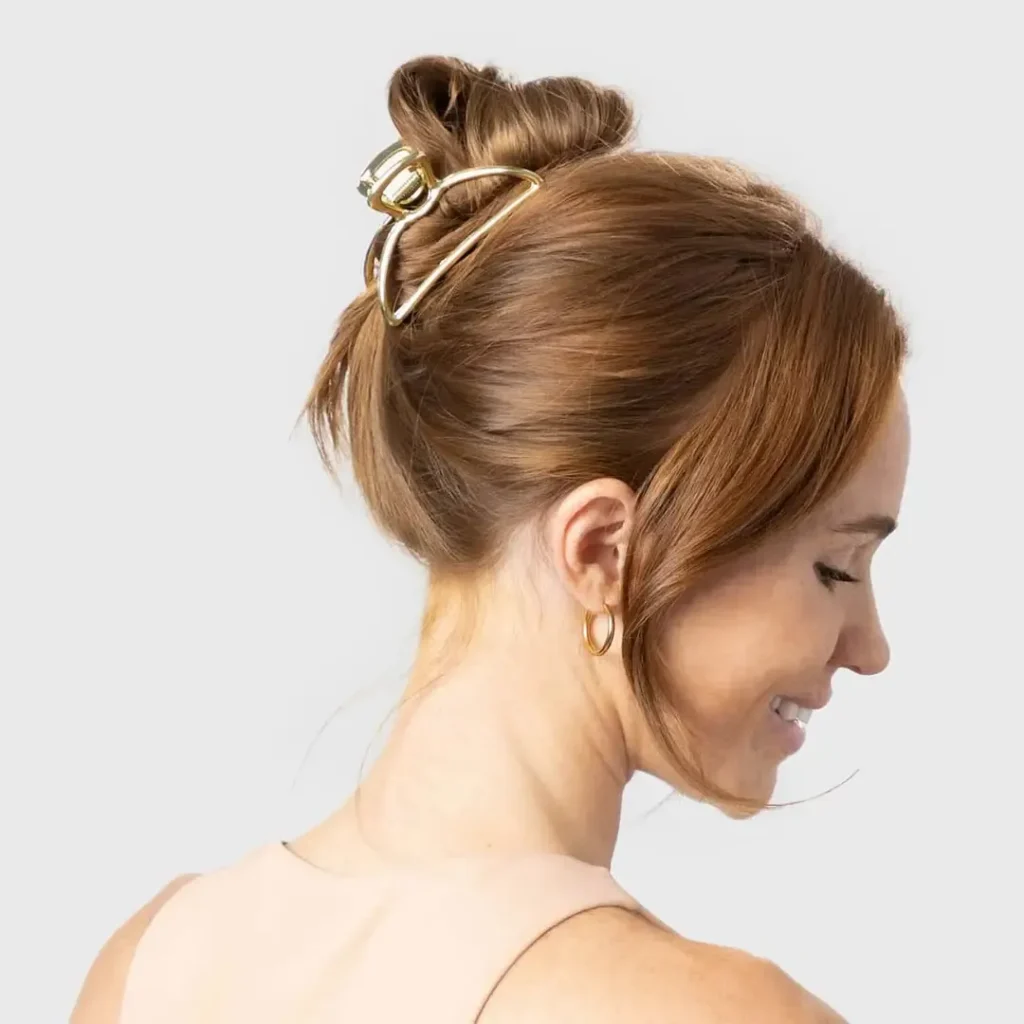 A set of silicone-coated claw clips by the brand Kitsch, designed for textured hair.