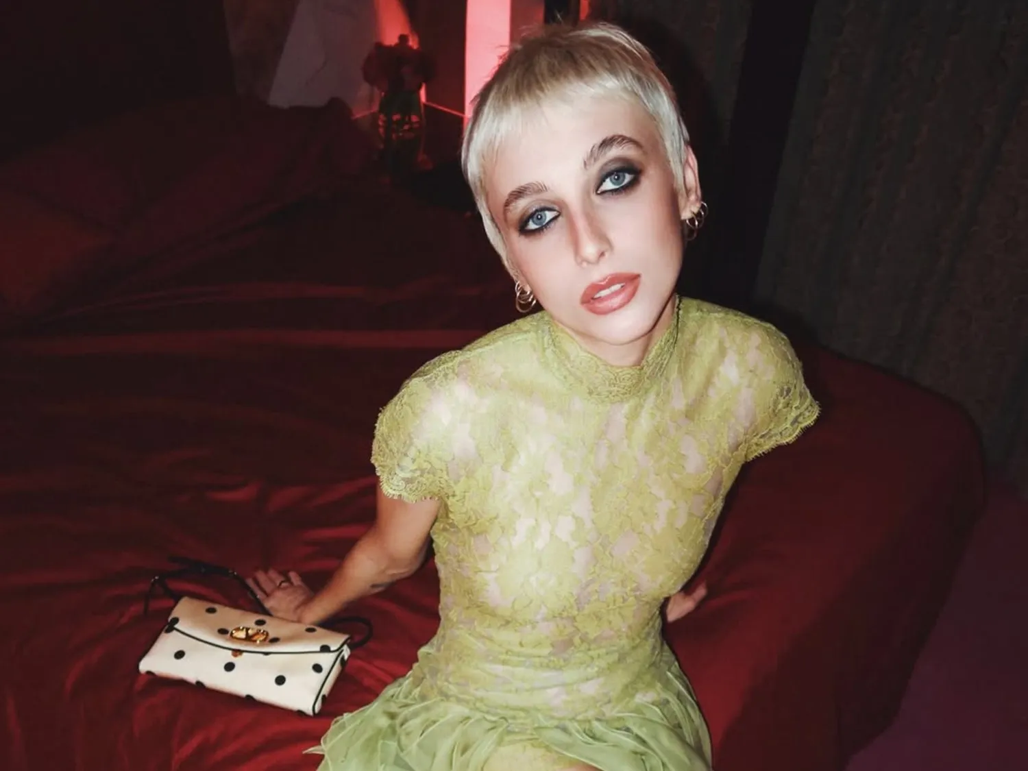 Emma Chamberlain with a short brunette bob and textured bangs.