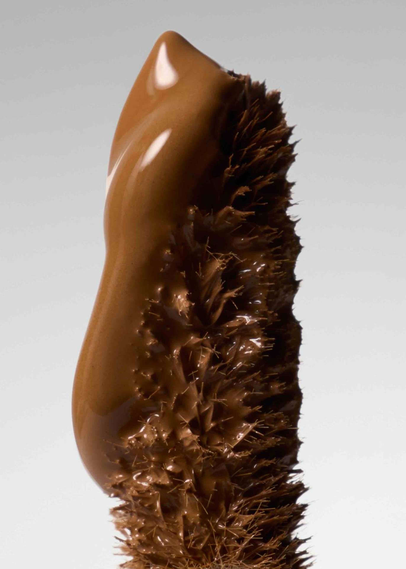 A detailed close-up of the dual-ended Patrick Ta concealer brush.