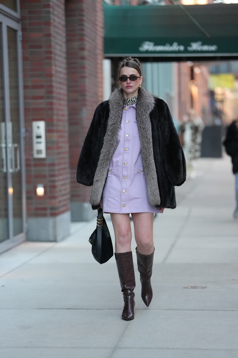 A close-up of a deep side part with a sleek 'wet look' finish on a fashion model.