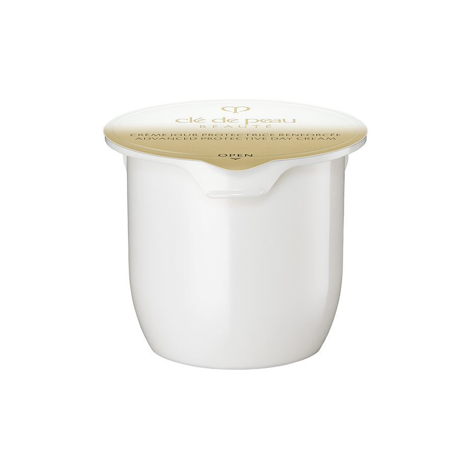 Clé de Peau Beauté Key Radiance Care products lined up on a surface.