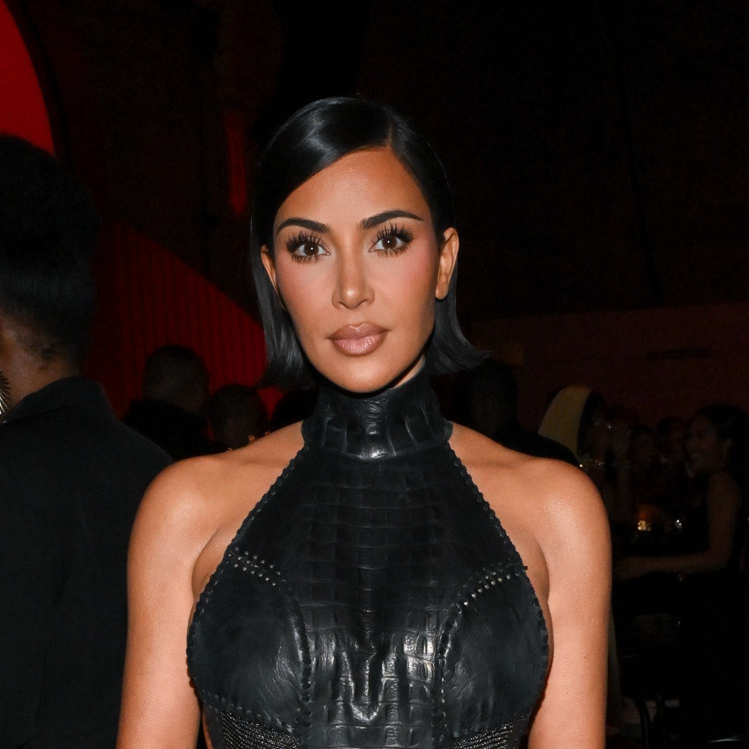Kim Kardashian sporting a sharp, chin-length blunt bob with a middle part.