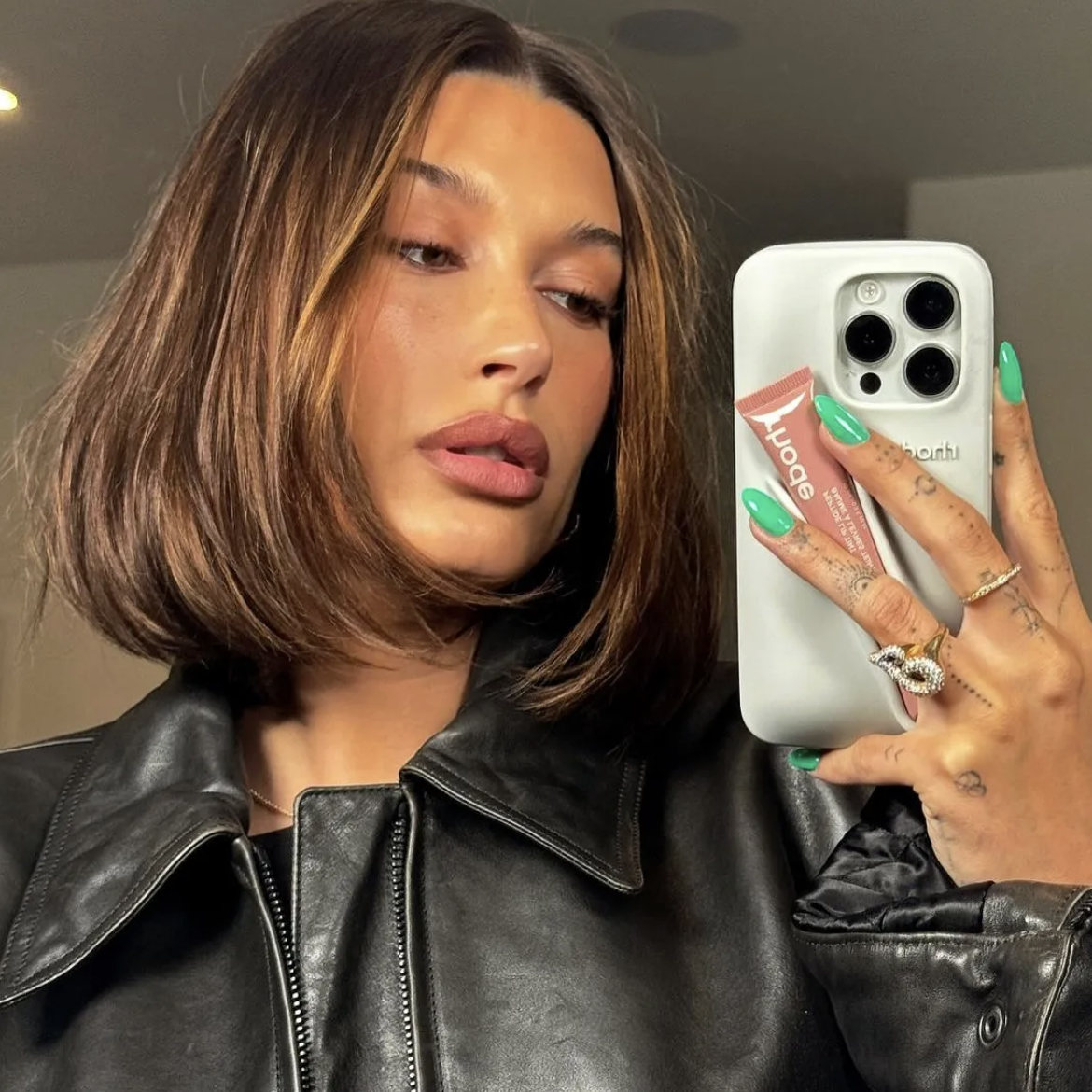 Hailey Bieber with a textured mid-length bob and soft waves.