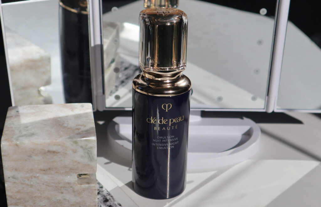 Close-up of the Clé de Peau Beauté Intensive Night Emulsion refillable glass bottle.