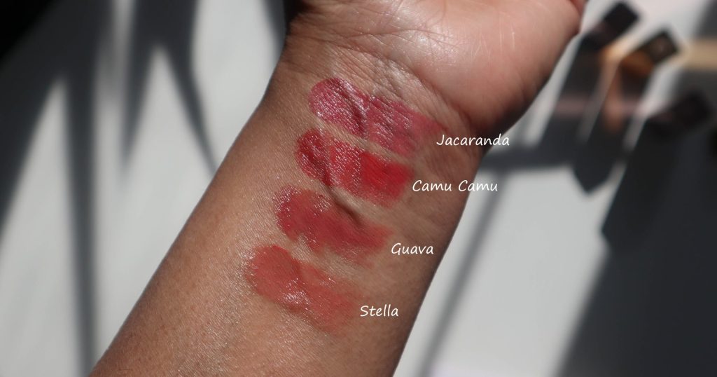 Multiple shades of Chantecaille Flamingo Lip Chic swatched on a forearm.