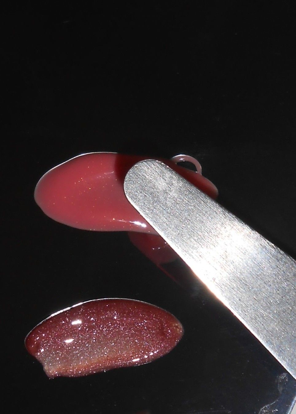 Rhode Peptide Lip Tints in the new shades Sweet Pea and Pretzel displayed in their signature minimalist grey packaging.