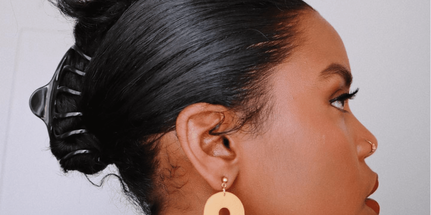 A graphic featuring the text 'The Truth About Claw Clips—And Whether They're Damaging Your Hair'.