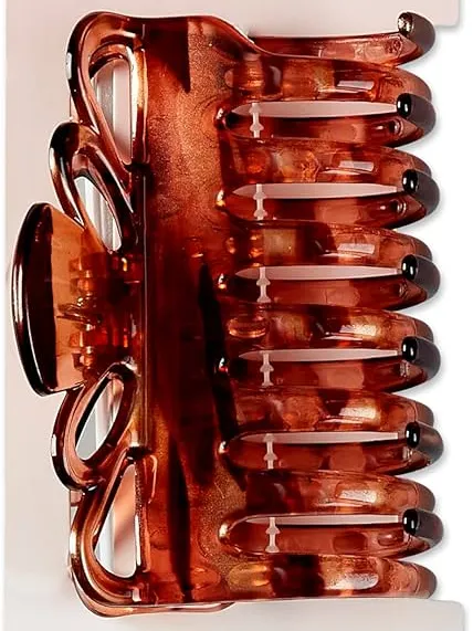 Lightweight hair claw clips from the Scunci brand with smooth plastic finishes.