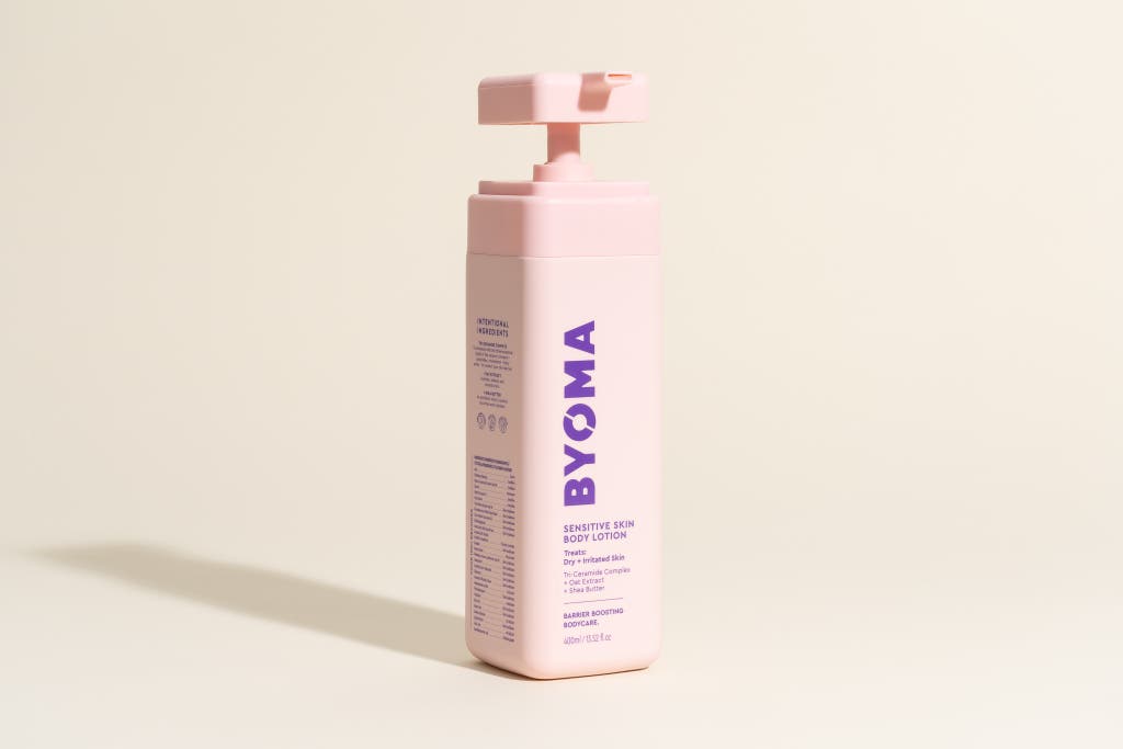 A pink square bottle of Byoma Sensitive Skin Body Lotion.