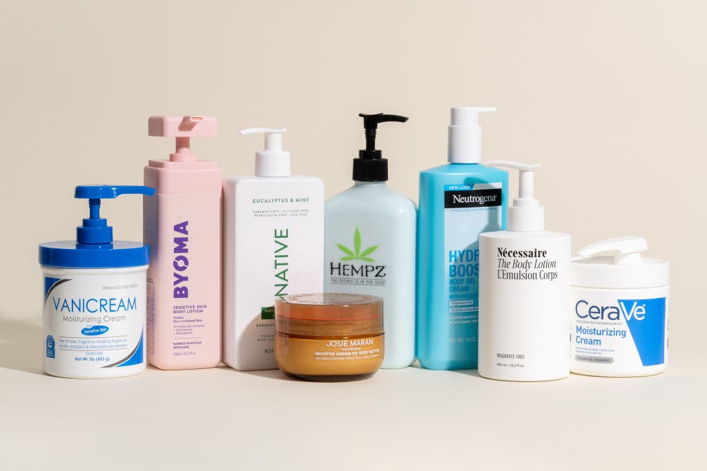 A collection of high-end body moisturizer bottles and tubes.