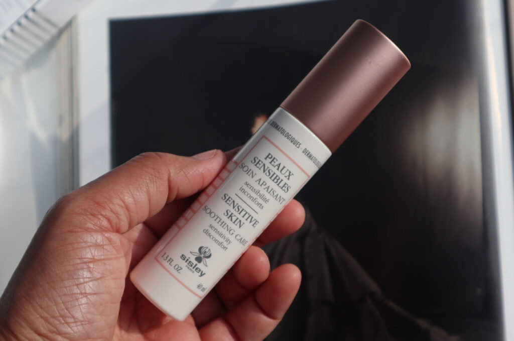 Sisley Paris Sensitive Skin Soothing Care moisturizer bottle shown from a slight angle.