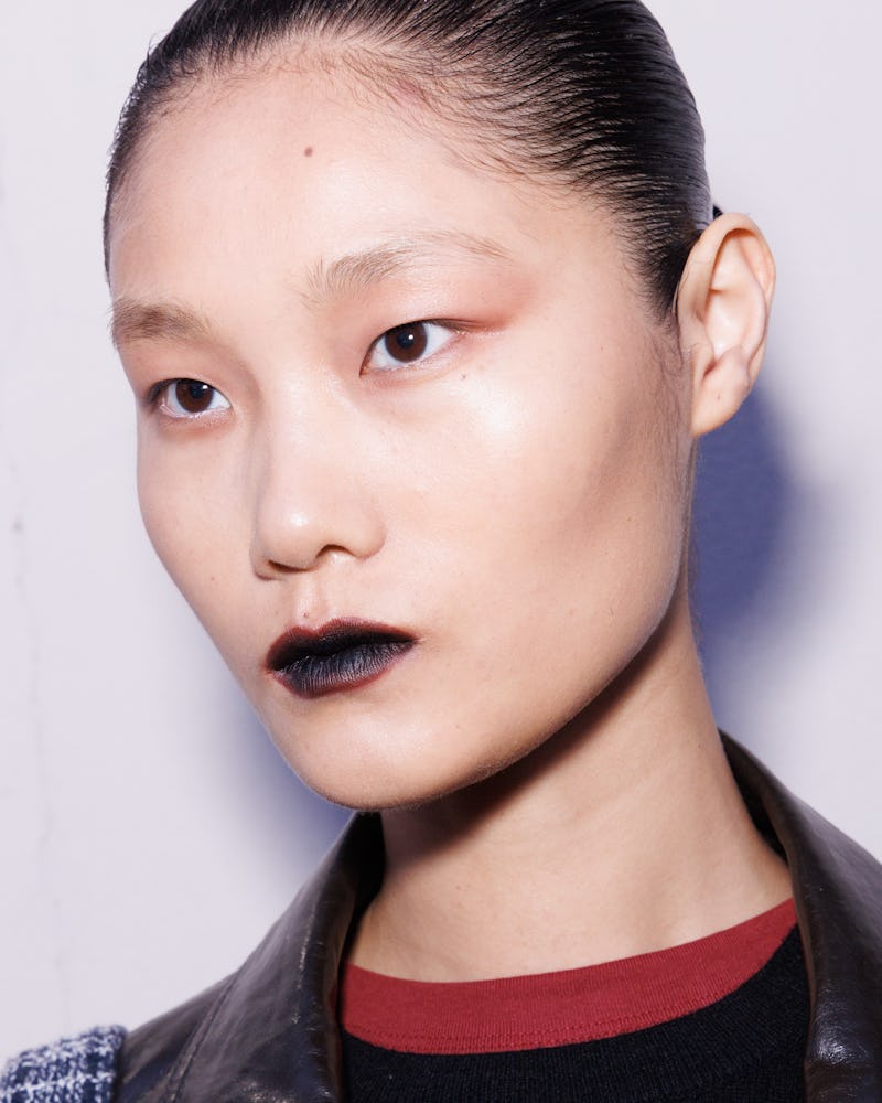 Model at the Roberto Cavalli Fall/Winter 2026 show wearing a deep oxblood vampy lip.