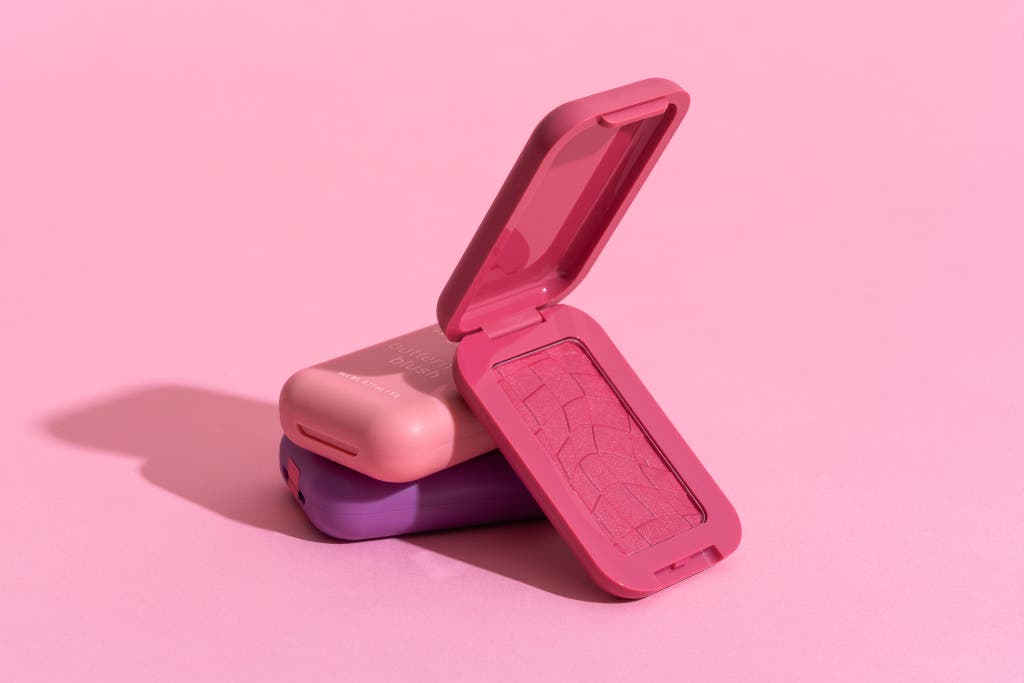 A compact of Nyx Professional Makeup Buttermelt Blush in a vibrant, high-pigment pink.