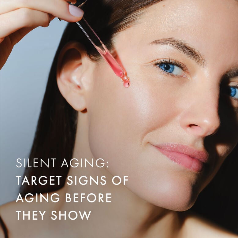 A close-up of the Sisley Paris Black Rose Radiant Youth Concentrate serum bottle.